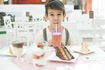 Image showing Child drink lemonade