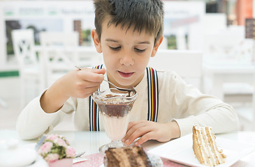 Image showing Child eat milk choco shake