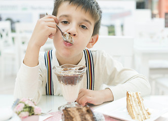 Image showing Child eat milk choco shake