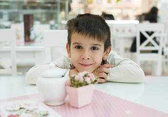 Image showing Child on table in confectionery