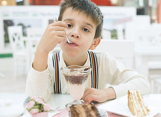 Image showing Child eat milk choco shake