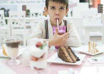 Image showing Child drink lemonade