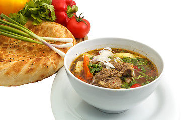 Image showing Kharcho soup with bread and vegetables