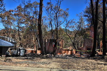 Image showing After the fire - burned houses and vehicles