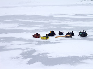 Image showing tourist backpacks in the winter on ice