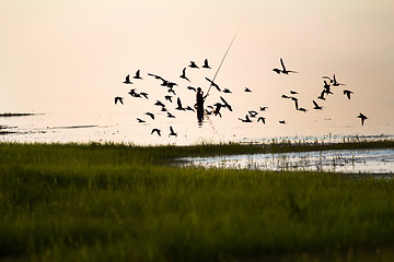 Image showing Fisherman silhouette on the lake