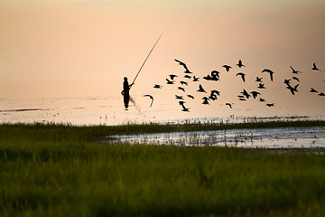 Image showing Fisherman silhouette on the lake
