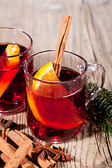 Image showing hot tasty spicy mulled red wine with orange and cinnamon christmas 