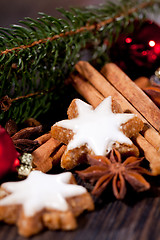 Image showing fresh tasty christmas cinnamon cookies and sticks decoration 