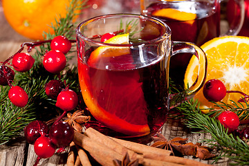 Image showing hot tasty spicy mulled red wine with orange and cinnamon christmas 