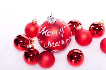 Image showing christmas decoration festive red bauble in snow isolated