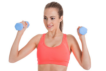 Image showing healthy smiling girl workout with dumbbell isolated 