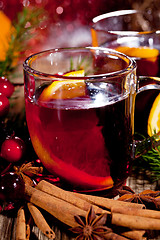 Image showing hot tasty spicy mulled red wine with orange and cinnamon christmas 