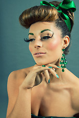 Image showing brunette woman with green jewelery and accssesoires