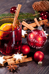 Image showing hot tasty spicy mulled red wine with orange and cinnamon christmas 