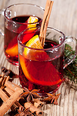 Image showing hot tasty spicy mulled red wine with orange and cinnamon christmas 