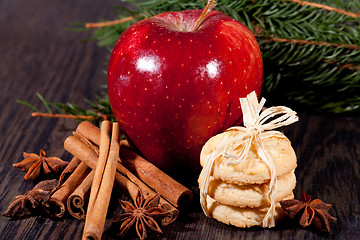 Image showing fresh tasty christmas cinnamon cookies and sticks decoration 