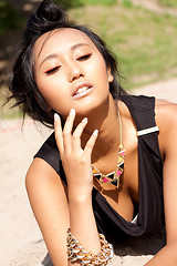 Image showing beautiful asian woman with colorful makeup on the beach 
