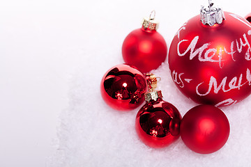 Image showing christmas decoration festive red bauble in snow isolated