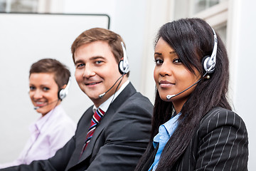 Image showing smiling callcenter agent with headset support