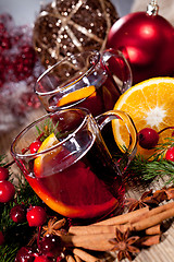 Image showing hot tasty spicy mulled red wine with orange and cinnamon christmas 