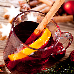 Image showing hot tasty spicy mulled red wine with orange and cinnamon christmas 