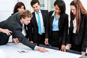 Image showing business people discussing architecture plan sketch 