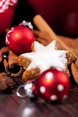 Image showing fresh tasty christmas cinnamon cookies and sticks decoration 