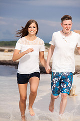 Image showing happy young couple on the beach in summer holiday love