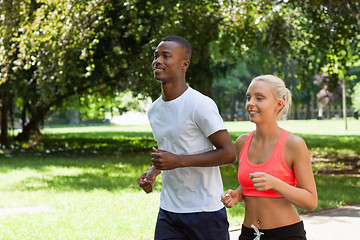 Image showing young couple runner jogger in park outdoor summer