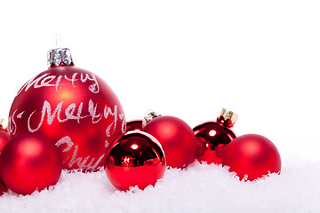 Image showing christmas decoration festive red bauble in snow isolated