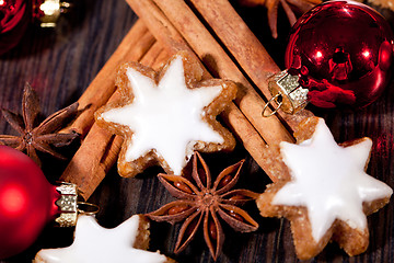 Image showing fresh tasty christmas cinnamon cookies and sticks decoration 