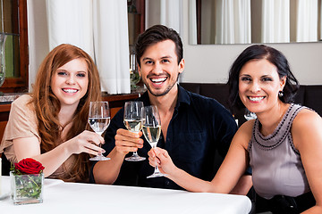 Image showing smiling happy people in restaurant