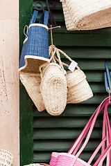 Image showing handmade colorful straw handbags on market sale summer