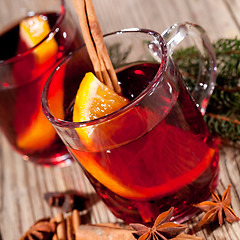 Image showing hot tasty spicy mulled red wine with orange and cinnamon christmas 