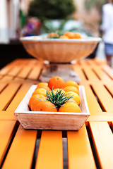 Image showing fresh orange fruits decorative on table in summer