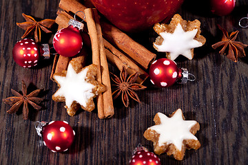 Image showing fresh tasty christmas cinnamon cookies and sticks decoration 