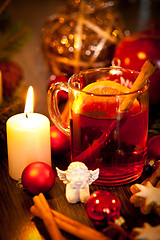 Image showing hot tasty spicy mulled red wine with orange and cinnamon christmas 