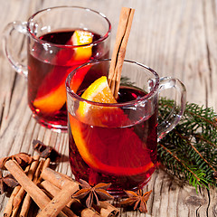 Image showing hot tasty spicy mulled red wine with orange and cinnamon christmas 