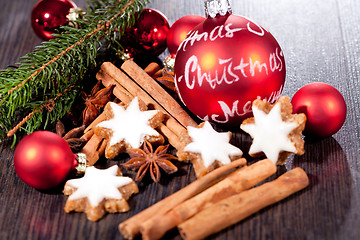 Image showing fresh tasty christmas cinnamon cookies and sticks decoration 