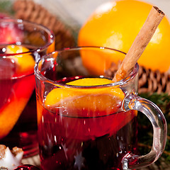 Image showing hot tasty spicy mulled red wine with orange and cinnamon christmas 