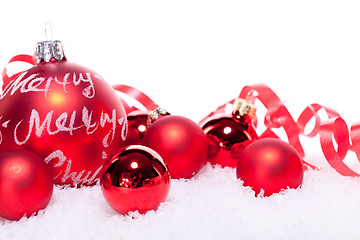 Image showing christmas decoration festive red bauble in snow isolated