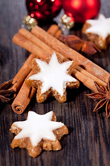 Image showing fresh tasty christmas cinnamon cookies and sticks decoration 