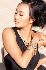 Image showing beautiful asian woman with colorful makeup on the beach 