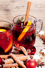 Image showing hot tasty spicy mulled red wine with orange and cinnamon christmas 