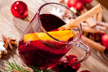 Image showing hot tasty spicy mulled red wine with orange and cinnamon christmas 