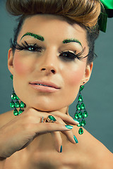 Image showing brunette woman with green jewelery and accssesoires