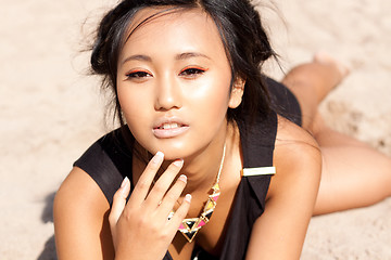 Image showing beautiful asian woman with colorful makeup on the beach 