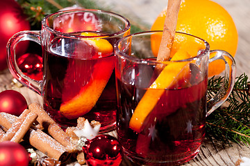 Image showing hot tasty spicy mulled red wine with orange and cinnamon christmas 