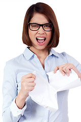 Image showing young frustrated asian business woman with paperwork crumpled